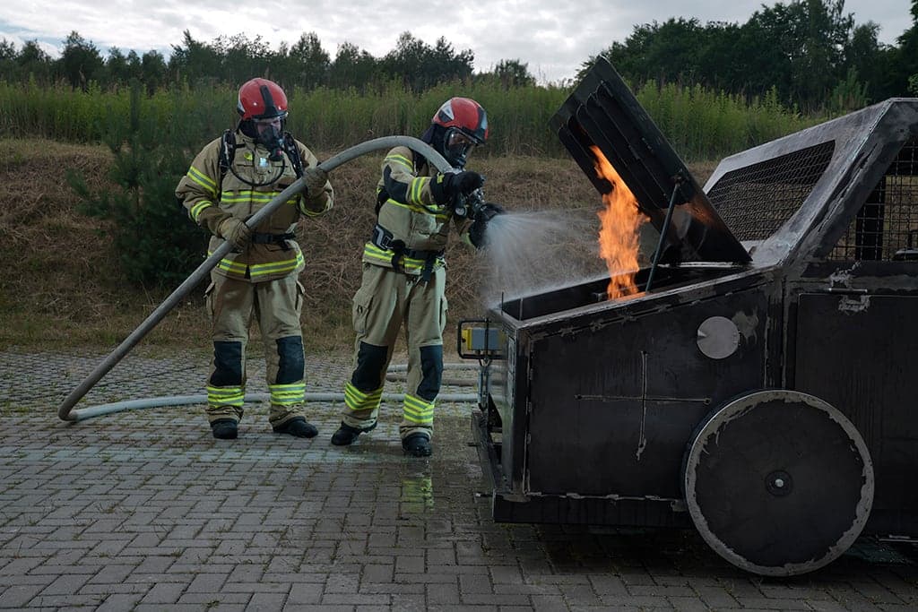 Training on how to extinguish car boot fire