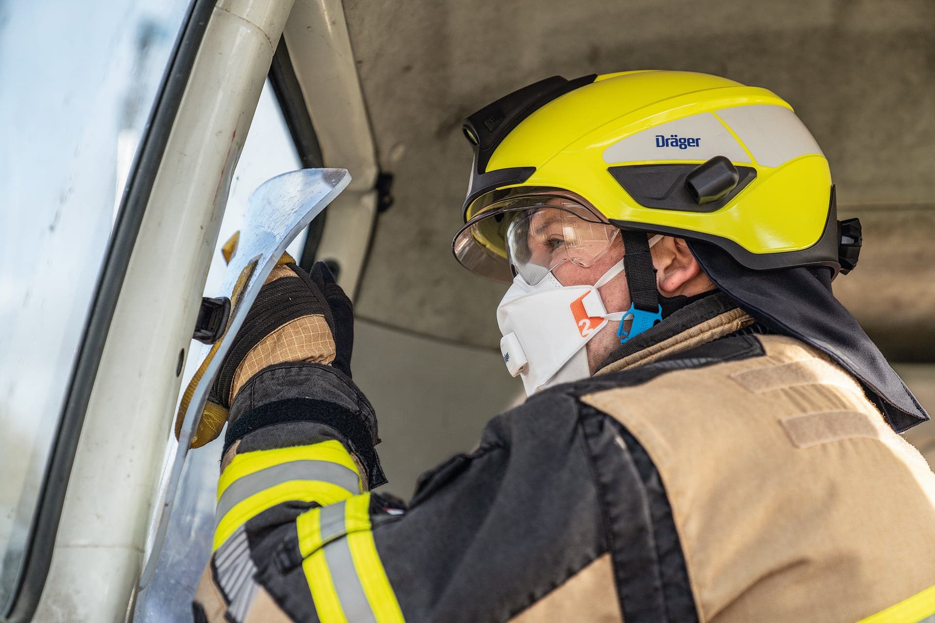 Fire fighter with multi-purpose helmet HPS SafeGuard during technical rescue
